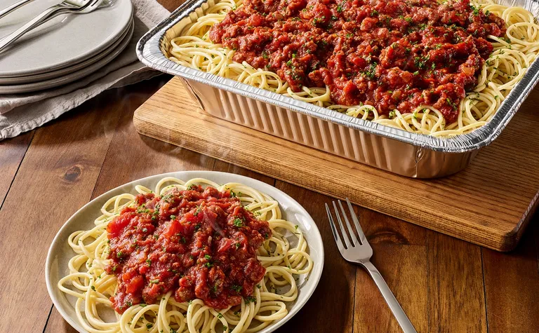 Spaghetti with Meat Sauce** (Serves 4 - 6) — Includes: A pan of spaghetti with our traditional homemade pan-seared beef and…