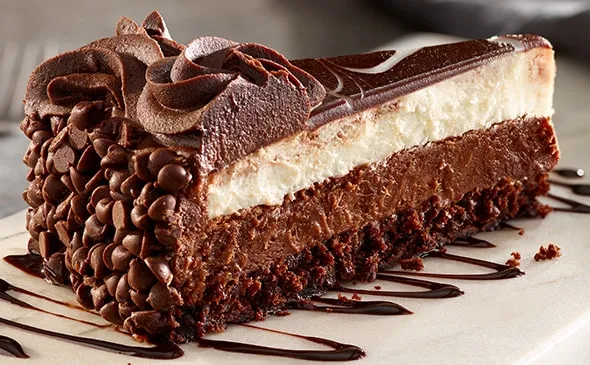 Black Tie Mousse Cake — Rich layers of chocolate cake, dark chocolate cheesecake and creamy custard mousse.