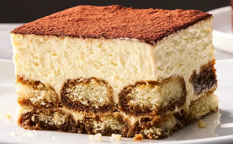 Tiramisu — The classic Italian dessert. A layer of creamy custard set atop espresso-soaked ladyfingers.