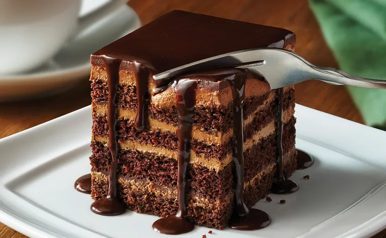Chocolate Lasagna — Decadent layers of chocolate cake, creamy chocolate mousse, and a delicate layer of crushed wafers…