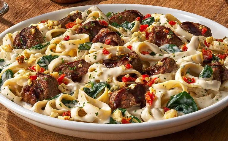 Steak Gorgonzola Alfredo — Grilled sirloin* tips over fettuccine alfredo, tossed with gorgonzola blue cheese and spinach…