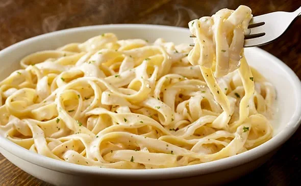 Fettuccine Alfredo — Our signature alfredo sauce made fresh in-house every morning with ingredients like parmesan, cream…
