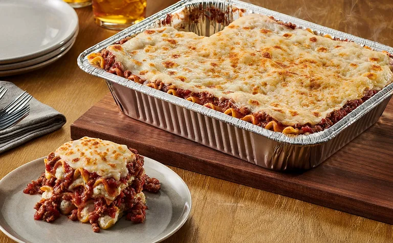 Lasagna Classico (Serves up to 12) — Layers of pasta, meat sauce and mozzarella, ricotta, parmesan and romano cheese. Allow…