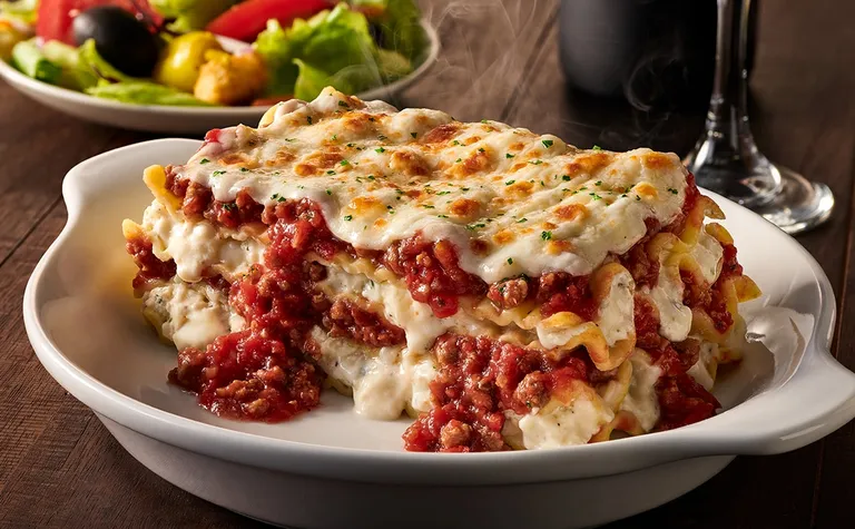 Lasagna Classico — Prepared fresh daily with layers of pasta, parmesan, mozzarella, pecorino romano and our homemade meat…