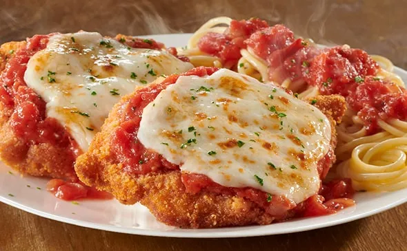 Chicken Parmigiana — Two lightly fried parmesan-breaded chicken breasts with our homemade marinara and melted Italian…