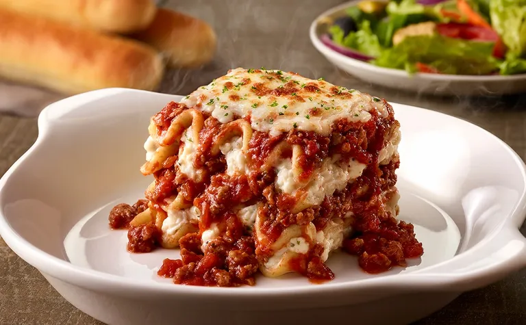 Lasagna Classico — Layers of pasta, Italian cheeses, and our homemade meat sauce.**