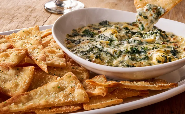 Spinach-Artichoke Dip — Start your meal with the Spinach-Artichoke Dip appetizer. It's a blend of spinach, artichokes and…
