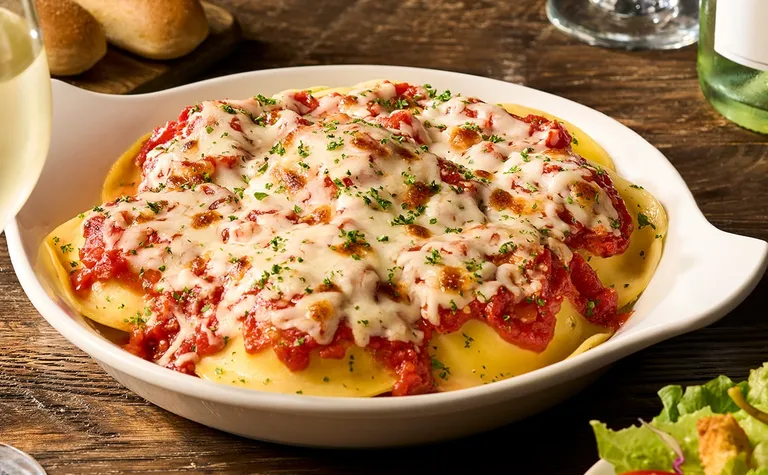 Cheese Ravioli — Filled with a blend of indulgent Italian cheeses, topped with your choice of homemade marinara or meat…