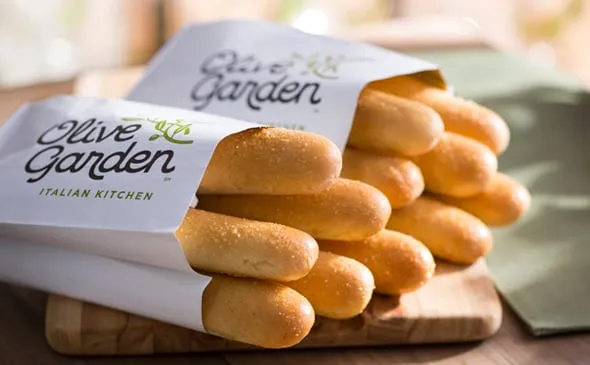 Breadsticks — Available Freshly-Baked or Bake-At-Home. Add an extra dozen or half dozen breadsticks to your online order.
