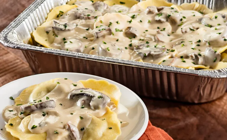 Limited Time Creamy Mushroom Ravioli (Serves 4 - 6) — Includes: A pan of portobello mushroom-filled ravioli in a creamy…