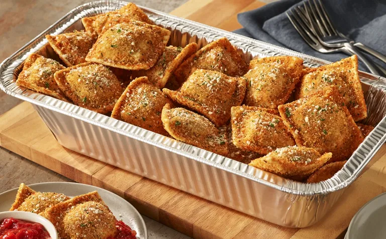Toasted Beef Ravioli (Serves 4 - 6) — Lightly fried ravioli stuffed with seasoned beef. Served with marinara.