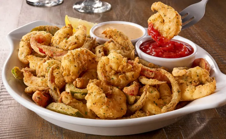 Shrimp Fritto Misto — Over a half pound of shrimp mixed with onions and bell peppers, hand breaded and lightly fried…
