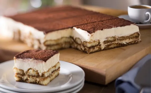 Tiramisu — The classic Italian dessert. A layer of creamy custard set atop espresso-soaked ladyfingers. Order a whole or…