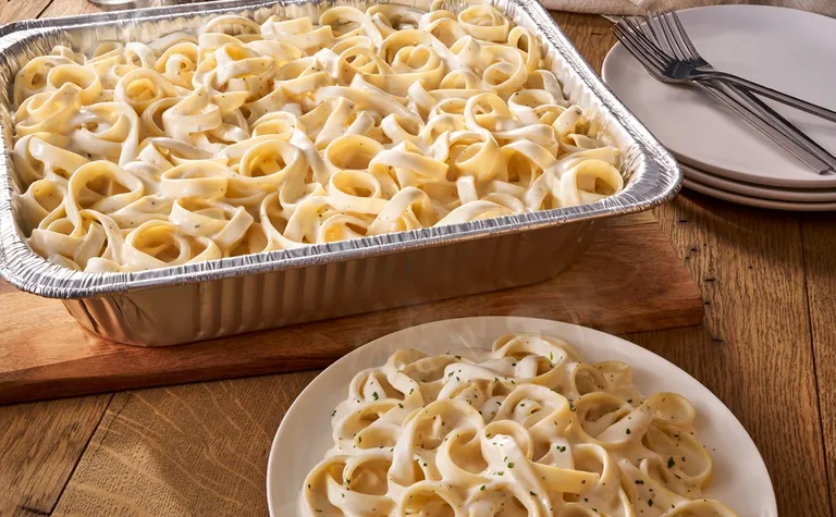 Fettuccine Alfredo (Serves 4 - 6) — Includes: A pan of fettuccine with our homemade alfredo sauce.