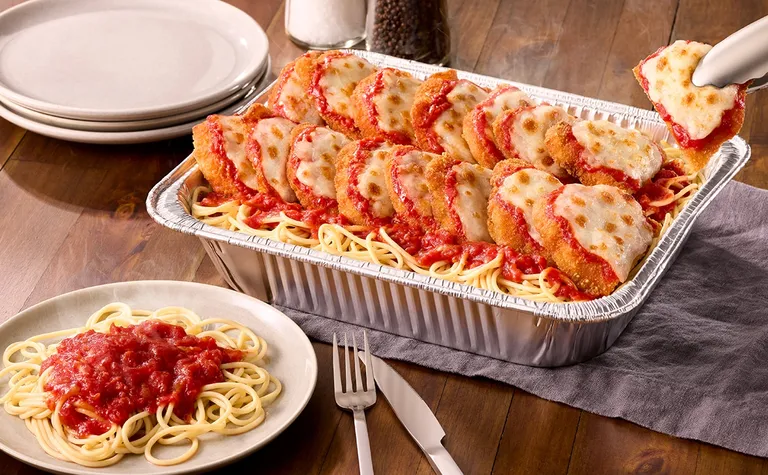 Chicken Parmigiana (Serves 4 - 6) — Homemade marinara and melted Italian cheeses over our lightly fried parmesan-breaded…